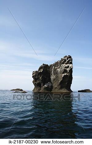 Stock Image - View of Sea with Huge Rock. Fotosearch