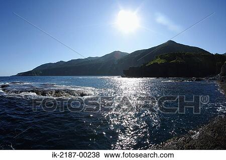 Stock Photo - View of Sea with Huge Rock. Fotosearch