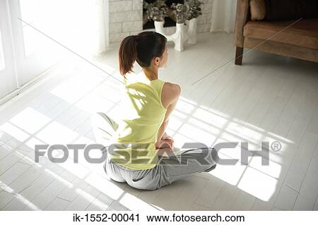 Stock Image - Woman doing yoga exercise . Fotosearch