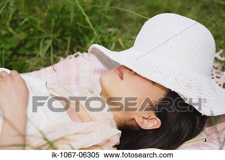 Woman wearing hat and resting View Large Photo Image Stock Photography - Woman wearing hat and resting. Fotosearch
