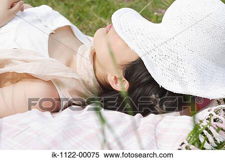 Woman wearing hat and resting View Large Photo Image Stock Photography - Woman wearing hat and resting . Fotosearch