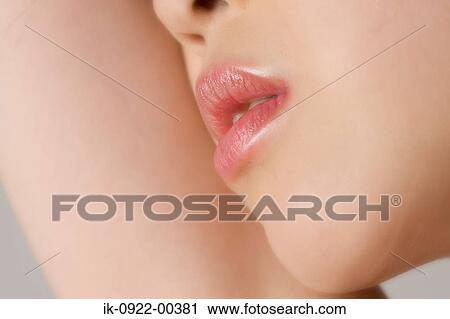 Stock Image - Woman’S Lips with Lipstick Applied. Fotosearch