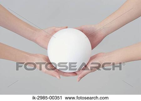 Women Holding Ball in Their Hands View Large Photo Image Stock Image - Women Holding Ball in Their Hands. Fotosearch
