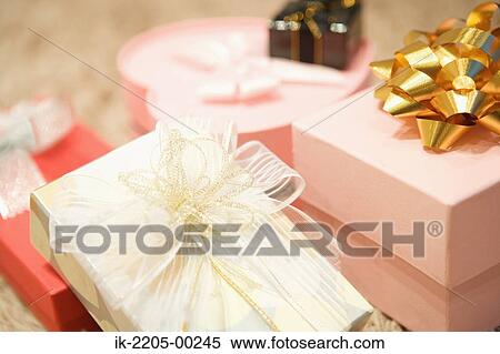 Stock Photography - Wrapped present with an ornate bow. Fotosearch