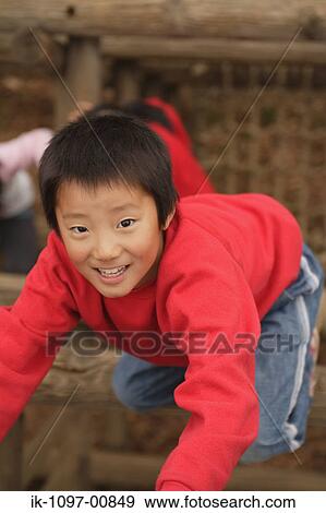 Young Boy Climbing on Wooden Jungle Gym View Large Photo Image Stock Photo - Young Boy Climbing on Wooden Jungle Gym. Fotosearch
