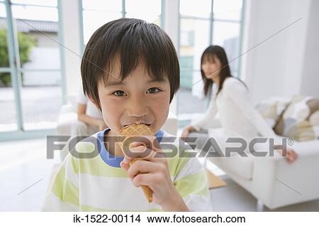 Young Boy Enjoying Ice Cream View Large Photo Image Picture - Young Boy Enjoying Ice Cream. Fotosearch