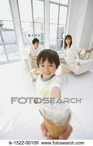 Young Boy Enjoying Ice Cream View Large Photo Image Stock Photo - Young Boy Enjoying Ice Cream. Fotosearch