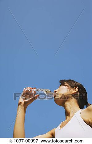 Stock Photo - Young Woman Drinking Water. Fotosearch