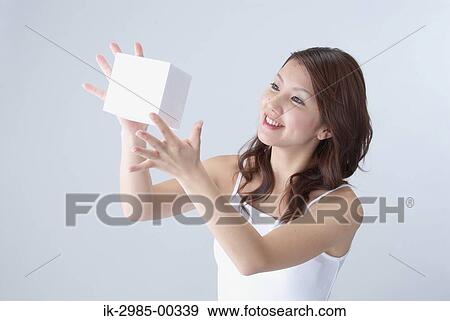 Young Woman Holding White Cube View Large Photo Image Stock Photo - Young Woman Holding White Cube. Fotosearch
