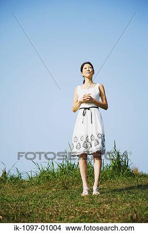 Picture - Young Woman in Summer Dress. Fotosearch