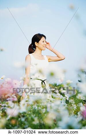 Young Woman in Summer Dress View Large Photo Image Picture - Young Woman in Summer Dress. Fotosearch