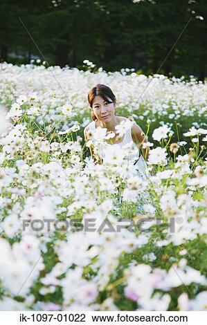 Stock Image - Young Woman in Summer Dress. Fotosearch