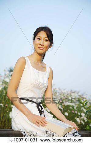 Stock Image - Young Woman in Summer Dress. Fotosearch