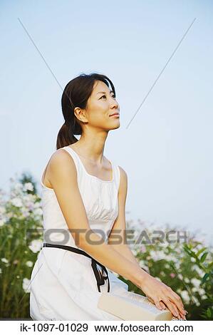 Stock Photo - Young Woman in Summer Dress. Fotosearch