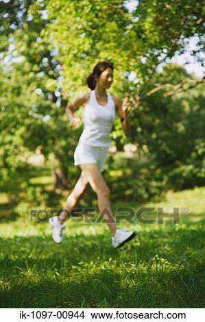 Young Woman Jogging View Large Photo Image Picture - Young Woman Jogging. Fotosearch