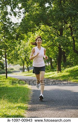 Young Woman Jogging View Large Photo Image Stock Image - Young Woman Jogging. Fotosearch