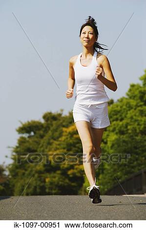 Young Woman Jogging View Large Photo Image Stock Image - Young Woman Jogging. Fotosearch