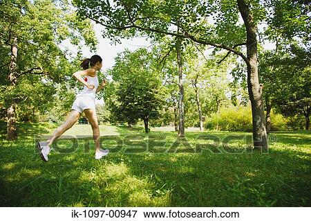 Young Woman Jogging View Large Photo Image Stock Photo - Young Woman Jogging. Fotosearch