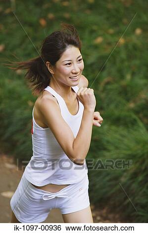 Young Woman Jogging View Large Photo Image Stock Photograph - Young Woman Jogging. Fotosearch