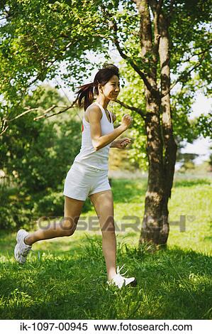 Young Woman Jogging View Large Photo Image Stock Photography - Young Woman Jogging. Fotosearch