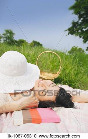 Young woman sleeping with book View Large Photo Image Stock Image - Young woman sleeping with book. Fotosearch