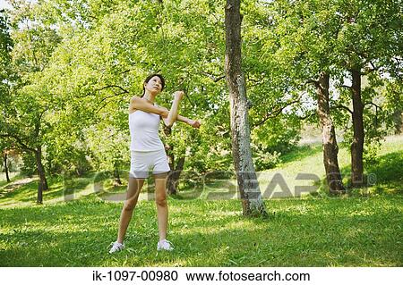 Stock Image - Young Woman Stretching. Fotosearch