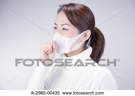 Stock Photography - Young Woman Wearing Face Mask. Fotosearch