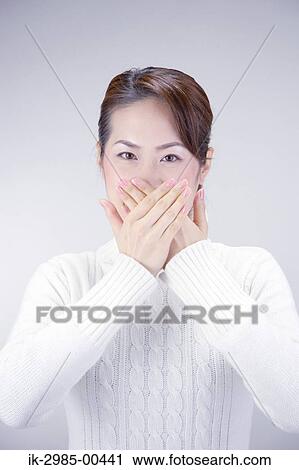 Young Woman with Hands on Her Lips View Large Photo Image Stock Image - Young Woman with Hands on Her Lips. Fotosearch