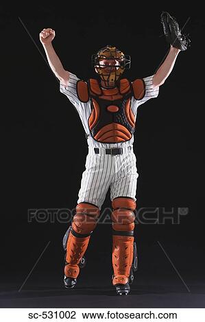 Stock Image - A baseball catcher cheering. Fotosearch