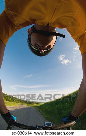 A man cycling on road View Large Photo Image Picture - A man cycling on road. Fotosearch