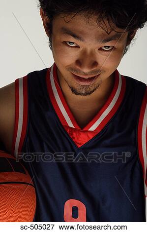 Stock Photo - Asian Basketball Player Making a Scary Face. Fotosearch