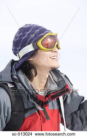 Picture - Asian male snowboarder. Fotosearch