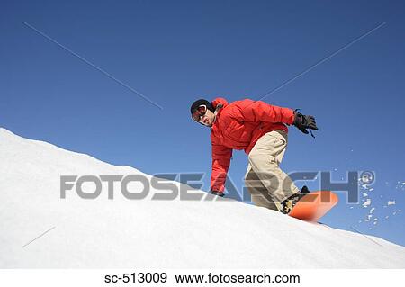 Stock Photo - Asian male snowboarder. Fotosearch