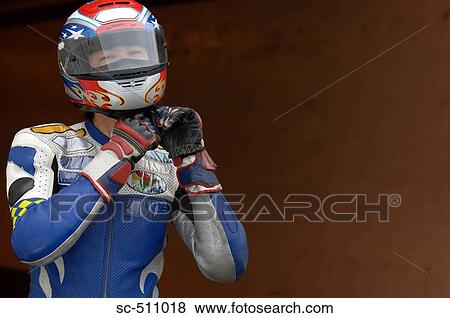Asian racing motor biker preparing for race View Large Photo Image Stock Photo - Asian racing motor biker preparing for race. Fotosearch