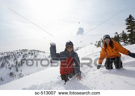 Asian snowboarders with snowball View Large Photo Image Stock Photo - Asian snowboarders with snowball. Fotosearch