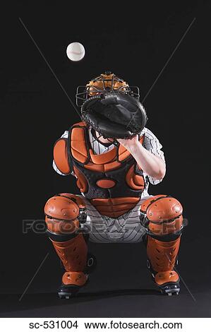 Picture - Baseball catcher catching ball. Fotosearch