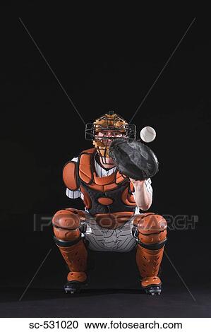 Stock Image - Baseball catcher catching ball. Fotosearch