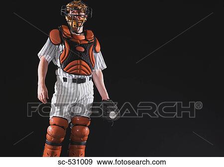 Stock Photo - Baseball catcher holding ball in mitt. Fotosearch