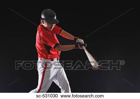 Stock Image - Baseball player about to hit the ball. Fotosearch