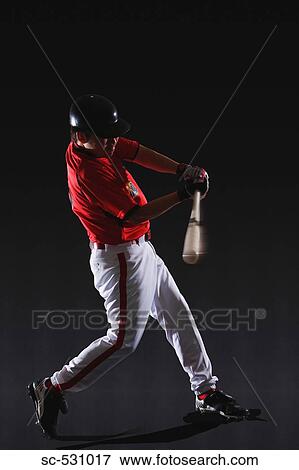 Stock Photo - Baseball player about to hit the ball. Fotosearch