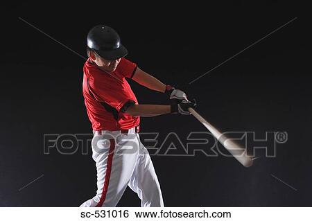 Stock Photograph - Baseball player about to hit the ball. Fotosearch