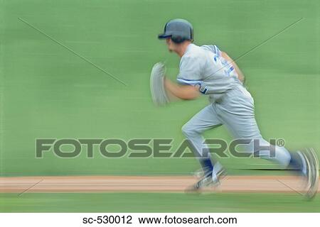 Stock Image - Baseball Player Running to Base. Fotosearch