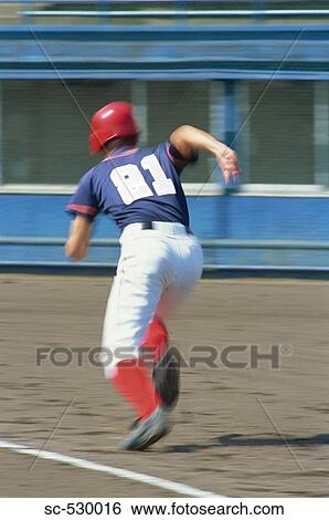 Stock Photograph - Baseball Player Running to Base. Fotosearch
