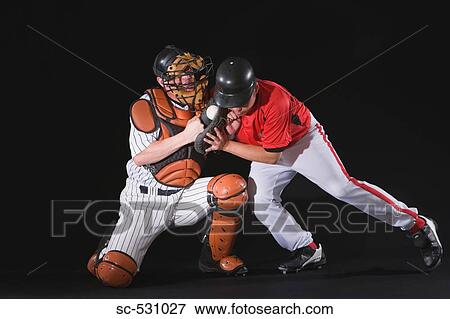 Stock Photo - Baseball player sliding into a base. Fotosearch