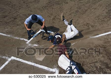 Stock Photography - Baseball Players Sliding into Base. Fotosearch