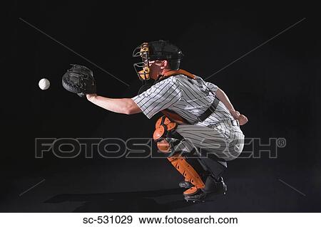 Stock Photo - Baseball umpire in crouching position. Fotosearch