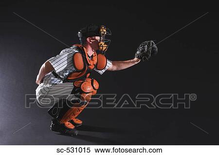 Stock Photography - Baseball umpire in crouching position. Fotosearch