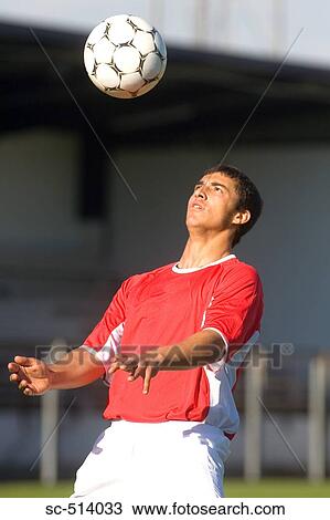 Stock Image - Boy controlling Soccer ball. Fotosearch