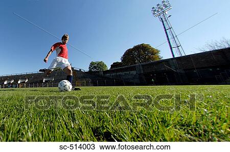 Boy shooting Soccer ball View Large Photo Image Stock Image - Boy shooting Soccer ball. Fotosearch