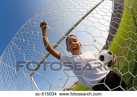 Picture - Boy shouting in Goal. Fotosearch